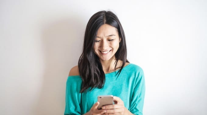 person happy to get approved for a $1,000 loan on their smartphone