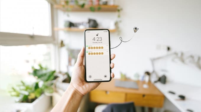 smartphone with dollar signs displayed on the screen.