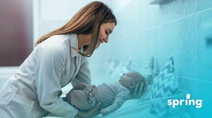 Woman holding baby after getting freebies