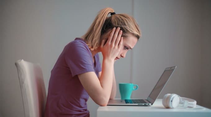 Person reviewing their declined loan application online