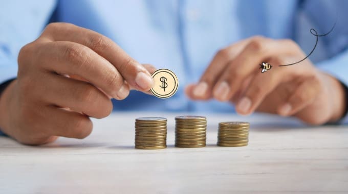 Coins and calculator belonging to person researching rrsp savings accounts