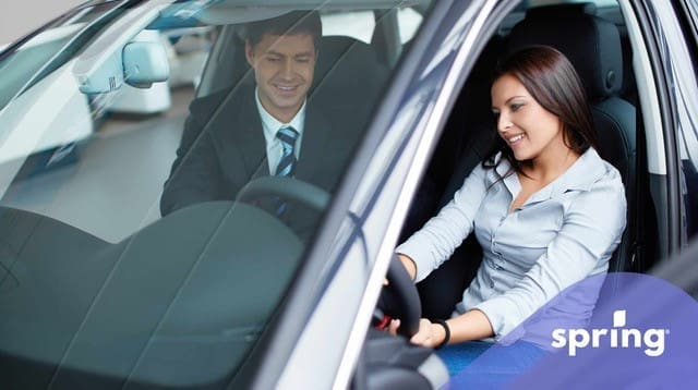 Woman test driving a bought car and a leased car