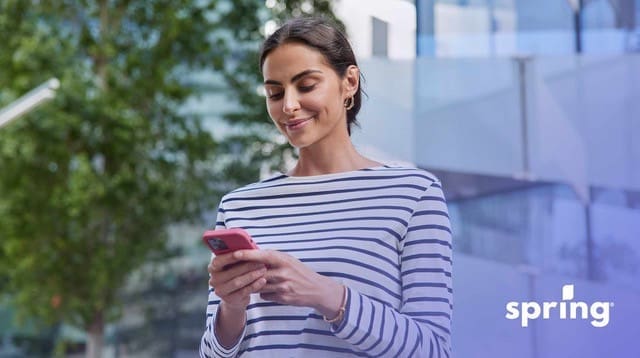 Woman using a private lender on her phone for a personal loan