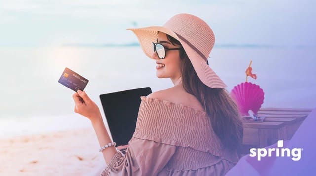 Woman on vacation using Canadian travel credit card