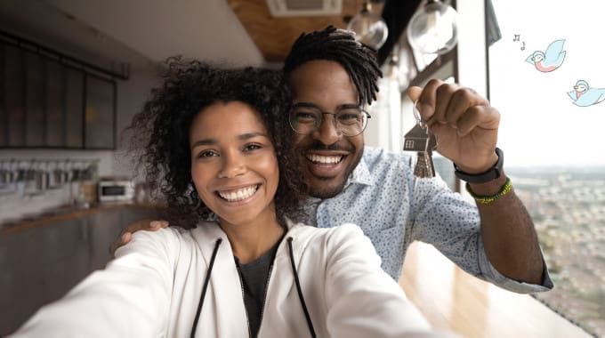 Couple takes a selfie after getting the keys to their new home