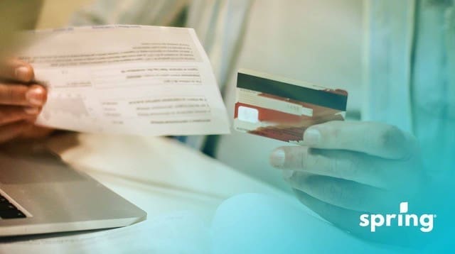 Credit card and credit statement being read