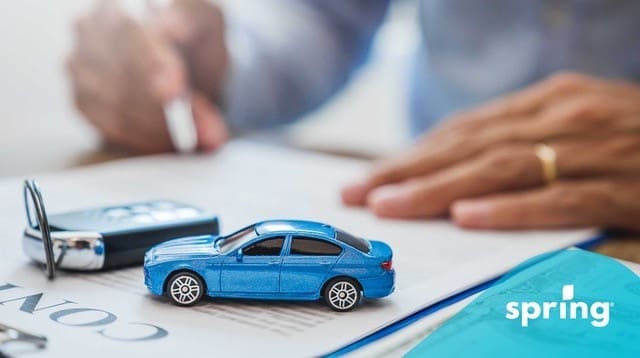 Woman doing car refinancing paperwork in Canada