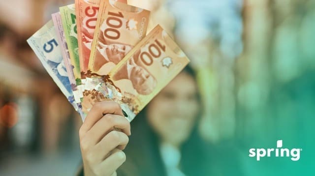 Woman showing BC income assistance amount